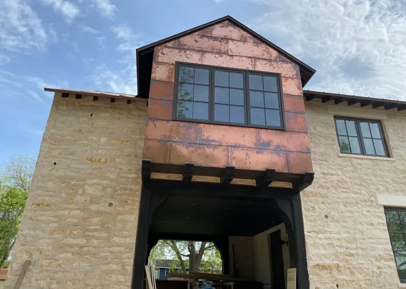 Copper metal panel facade on a stone building for Skylight Installation in North Tustin
