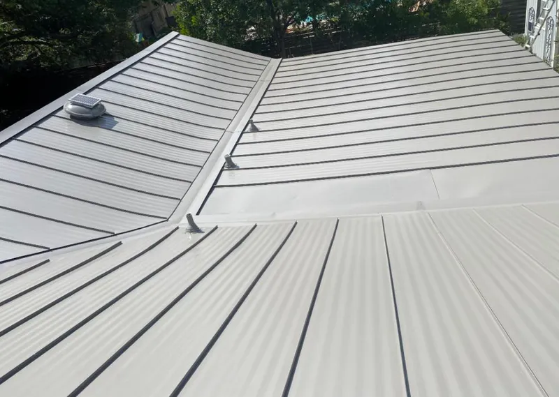 Solar attic fan installed on a metal roof for Roof Ventilation in North Tustin